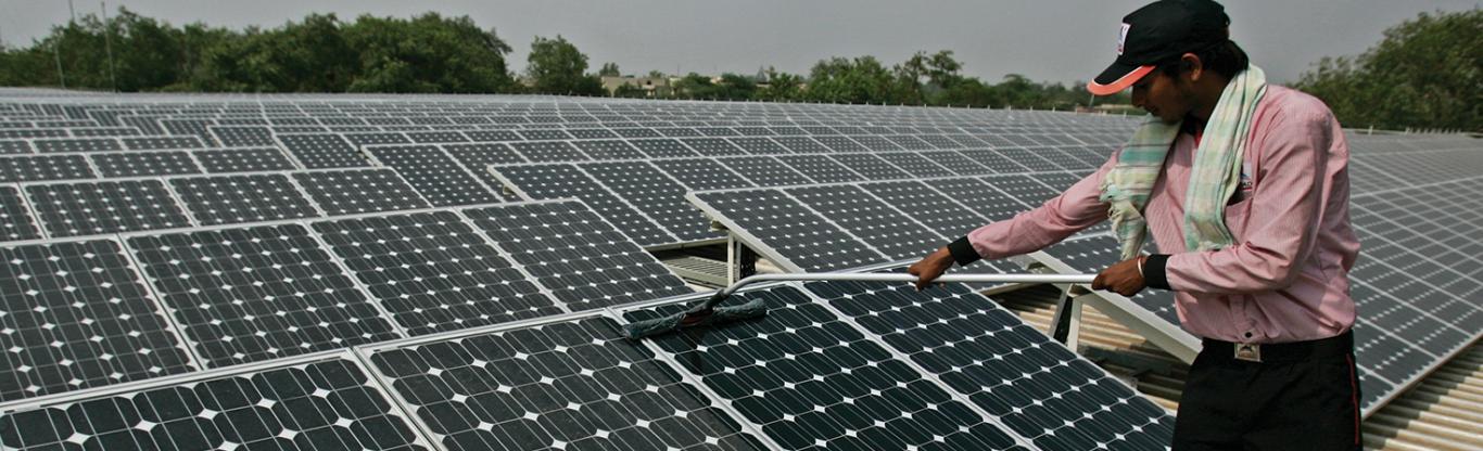 Solar Panel, worker cleaning PV panel